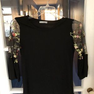 Black blouse with sheer embroidered sleeve